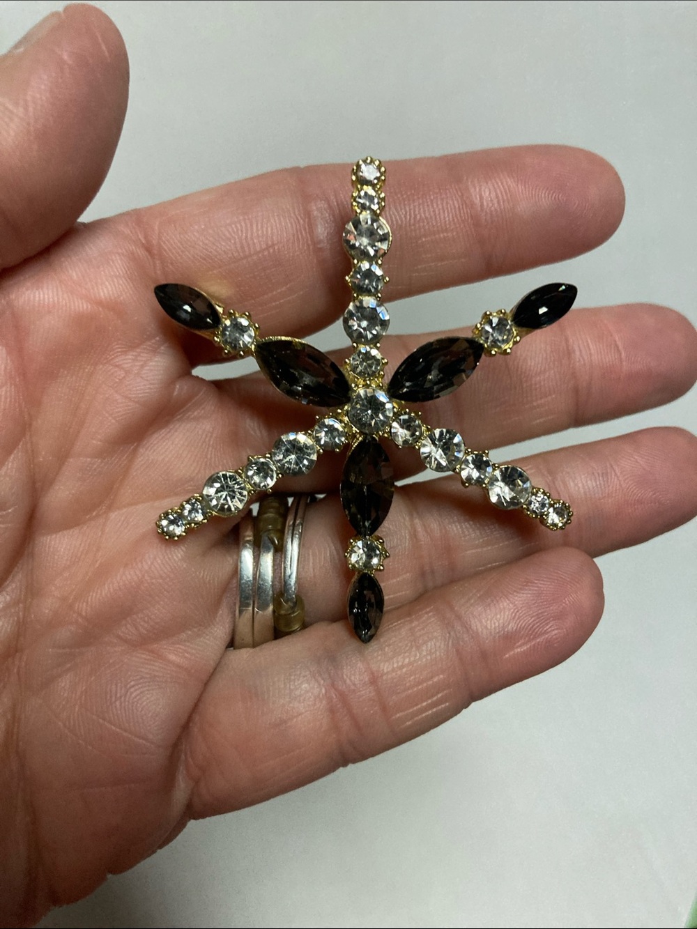 Gold-Tone Black & Clear Crystal Starburst Brooch - Sparkling Accent